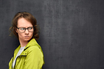 Portrait of angry girl with glasses
