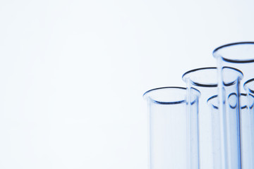 Empty medical glass test tubes on white