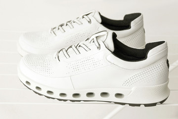 White trainers, natural leather waterproof sport wear, sneakers shoes.