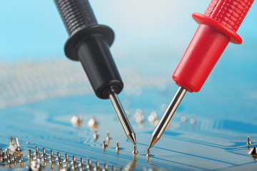 Check by multimeter, electronic circuit board of digital device with components. Troubleshooting in...