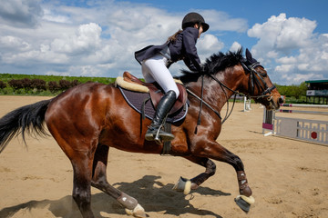young woman riding a horse