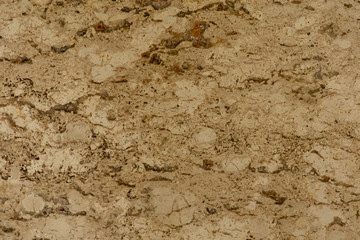 Golden marble texture of a natural white and golden stone tile.