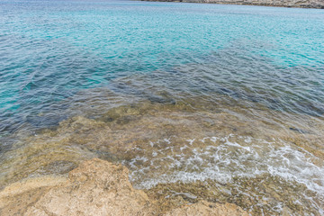 Ibiza, Mediterranean sea crashing against the rocks of the Spanish island of Mallorca, Ibiza, Spain.