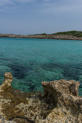 Tourism, Mediterranean sea crashing against the rocks of the Spanish island of Mallorca, Ibiza, Spain.