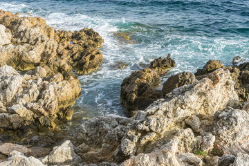 Mediterranean sea crashing against the rocks of the Spanish island of Mallorca, Ibiza, Spain.