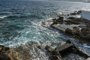 Tourism, Mediterranean sea crashing against the rocks of the Spanish island of Mallorca, Ibiza, Spain.