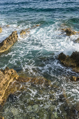 Mediterranean sea crashing against the rocks of the Spanish island of Mallorca, Ibiza, Spain.