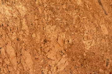 Golden marble texture of a natural white and golden stone tile.