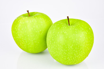 Close up the green apple have water droplets on the skin and have white background