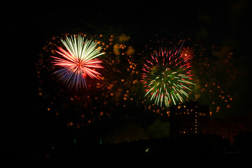 Beautiful colorful holiday fireworks in the night sky, long exposure