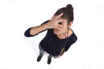 woman peeking with hand on face on white background