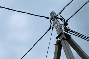 Electricity power pole with many wires and blue sky