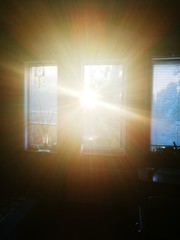 Sunset view from the window. Bright rays