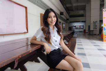 Portrait of thai adult student university uniform beautiful girl relax and smile