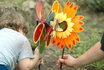 Parent and kid arranging artificial flowers