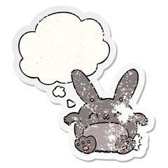 cartoon rabbit and thought bubble as a distressed worn sticker