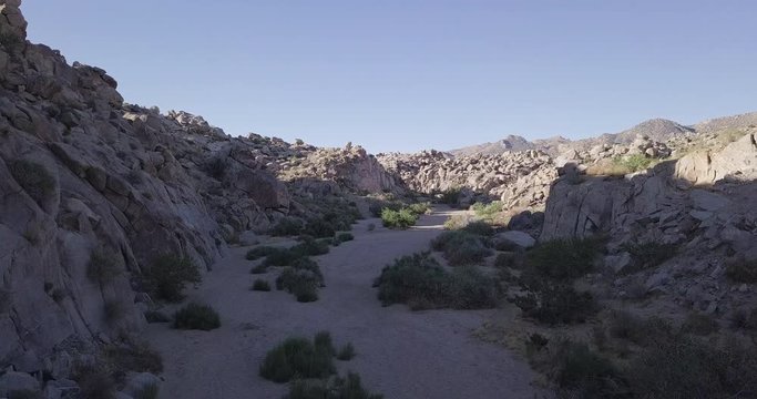 flying between rock formations  in Mojave desert, with Native American Petroglyphs, Pictographs, geoglyphs, Coyote Hole Canyon, Joshua tree, yucca valley,california, mojave desert