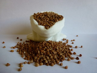 buckwheat in bowl on white background