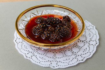 Jam from pine cones in jar.