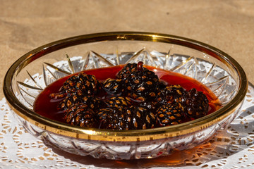 Jam from pine cones in jar.