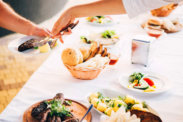 Catering Buffet Food Dish with Meat and Colorful vegetables on a Table