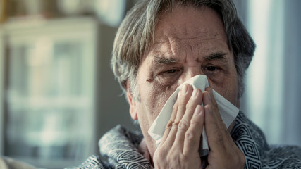 Senior man suffering from cold