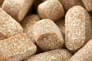 Close-up photo of many brown pills. Medicine