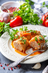 Cabbage rolls stuffed with ground beef and rice.