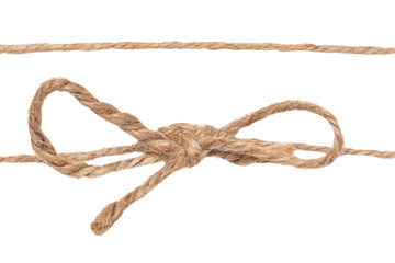 Closeup of twine node or knot with bow and one rope isolated on a white background. Decoration background.
