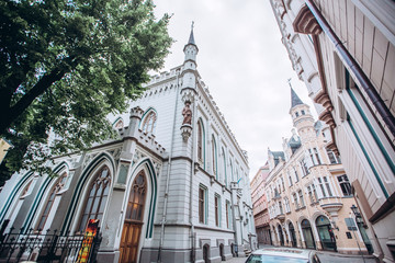 Obraz premium Narrow medieval street in the old town of Riga, Latvia. Architectural monuments on old Riga.