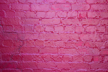 Brickwork crimson color with a reflection of sunny color.