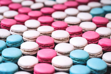Close up colorful macarons dessert vintage pastel blue and pink tones, union jack pattern, full frame background with copy space