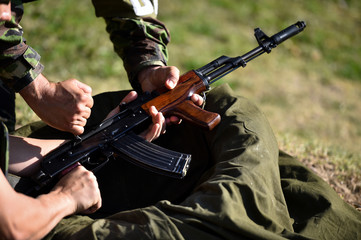 Outdoor target shooting with assault rifle