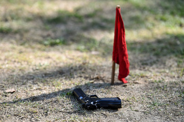 Outdoor target shooting with a 9mm pistol in a shooting range