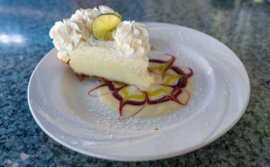 Gourmet cheesecake or lemon tart with cream
