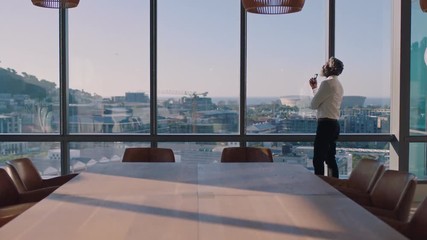 mature african american businessman looking out window planning ahead thinking of ideas for future business development with view of city at sunset 4k