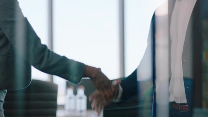 business people handshake successful partnership deal corporate executives shaking hands welcoming opportunity for cooperation in office 4k footage - Powered by Adobe