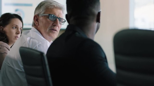 corporate business people brainstorming in boardroom meeting discussing strategy  senior shareholder asking question sharing ideas in office conference 4k