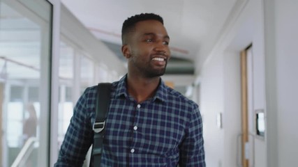 happy african american businessman  walking through office arriving at work smiling confident enjoying first day at new job 4k   - Powered by Adobe