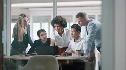 business people brainstorming using laptop computer team leader woman pointing at screen sharing creative ideas helping colleagues discussing project teamwork in modern office 4k - Powered by Adobe