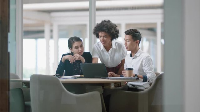 business woman team leader training interns using laptop computer pointing at screen sharing creative ideas helping colleagues discussing project teamwork in modern office 4k