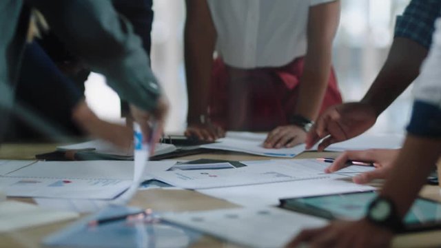 young business team meeting brainstorming ideas colleagues working together planning success strategy enjoying teamwork in office 4k