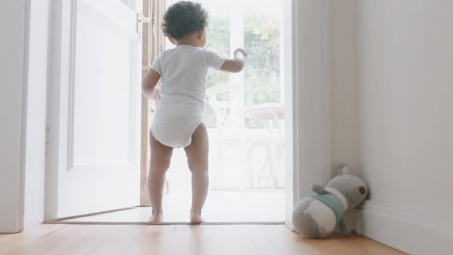 Happy Baby Girl Learning To Walk Toddler Exploring Home Curious Infant Walking Through House Enjoying Childhood