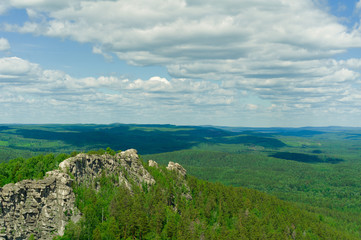 Fototapeta premium Rocky ridge with people wandering around it