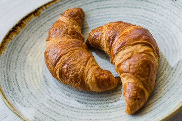 Beautiful croissant with jam on plate