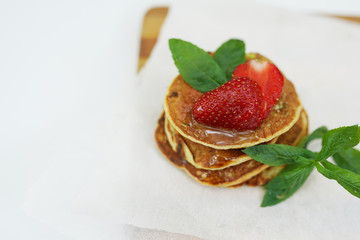 stack of freshly prepared traditional pancakes with strawberries, copy space