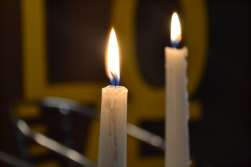 two candles light up the room