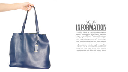 Fototapeta na wymiar Woman's female blue leather bag in hand, sample text on white background isolation