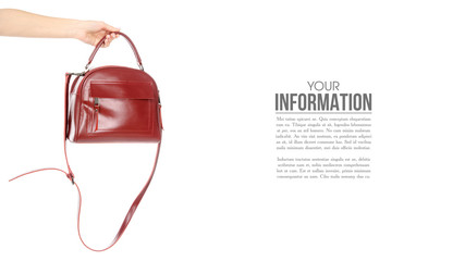 Woman's female red leather bag in hand, sample text on white background isolation