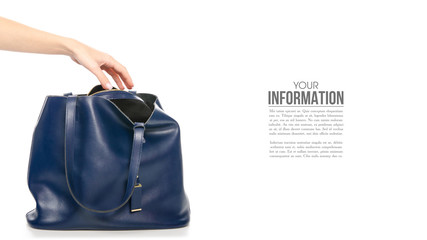Woman's female blue leather bag in hand, sample text on white background isolation